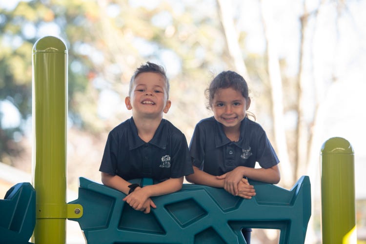 Students on play equipment